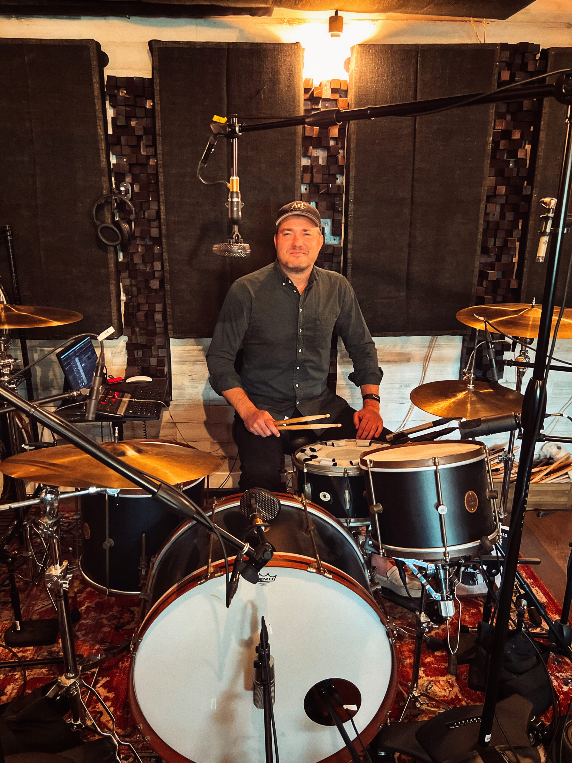 Blake Paulson at the drum kit inside Vose Street Sound, ready to track custom drum sessions.
